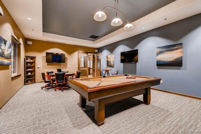 rec room featuring light carpet, pool table, and a raised ceiling