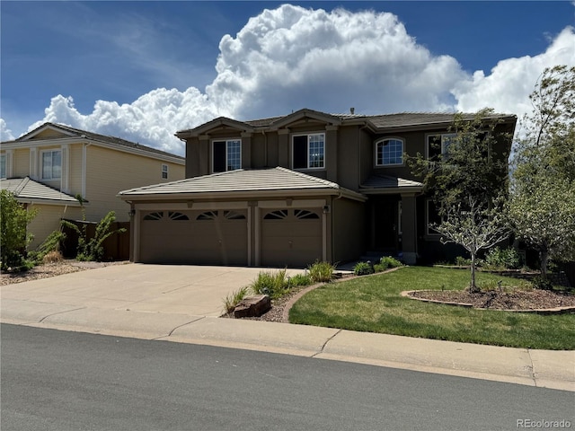 9109 Ironwood Way, Highlands Ranch, CO 80129 - traditional-style home with an attached garage, concrete driveway, stucco siding, and a front lawn