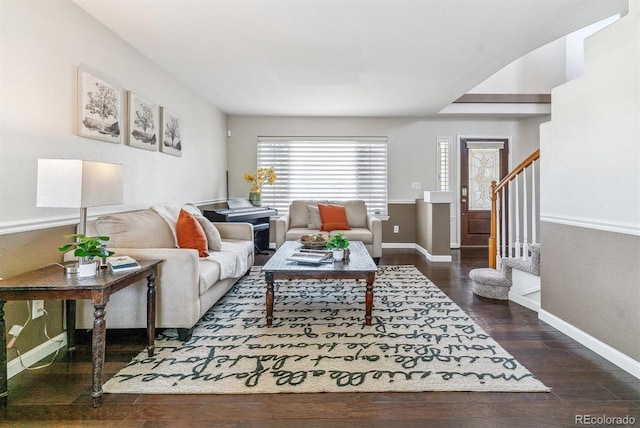 9109 Ironwood Way, Highlands Ranch, CO 80129 - living area featuring wood finished floors, baseboards, and stairs