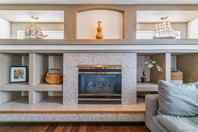 9109 Ironwood Way, Highlands Ranch, CO 80129 - details with a tile fireplace and wood finished floors