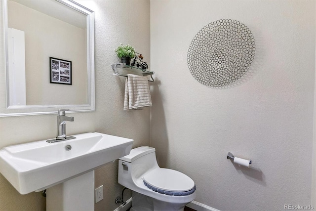 9109 Ironwood Way, Highlands Ranch, CO 80129 - half bath with a sink and toilet