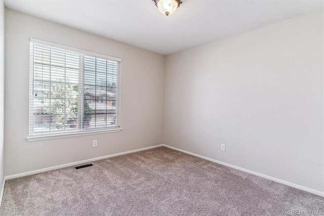 9109 Ironwood Way, Highlands Ranch, CO 80129 - carpeted spare room with plenty of natural light, visible vents, and baseboards