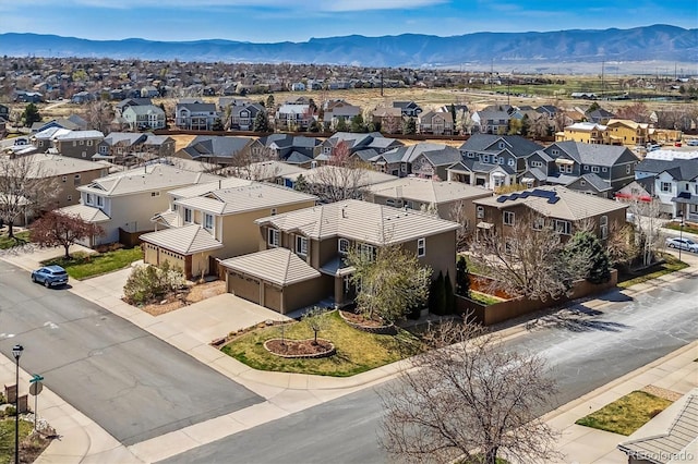 9109 Ironwood Way, Highlands Ranch, CO 80129 - aerial perspective of suburban area featuring a mountainous background