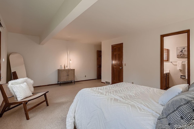 bedroom featuring connected bathroom, light colored carpet, beam ceiling, baseboards, and visible vents