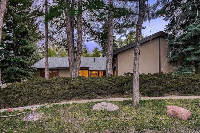 view of front of house featuring stucco siding