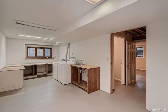 clothes washing area featuring laundry area and washer and dryer