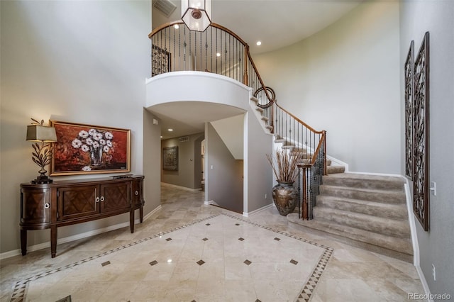19676 E Pinewood Dr, Aurora, CO 80016 - entrance foyer featuring a towering ceiling, stairway, and recessed lighting