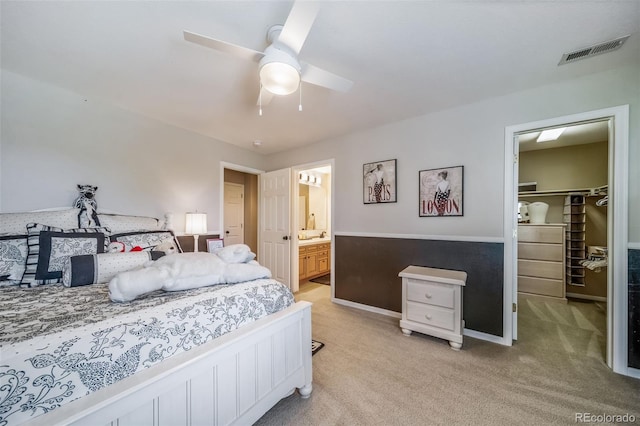 19676 E Pinewood Dr, Aurora, CO 80016 - bedroom featuring a walk in closet, light colored carpet, a closet, and ensuite bath