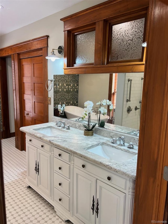 full bathroom featuring a stall shower and double vanity
