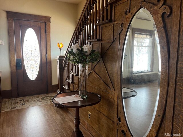 405 2nd Ave, Monte Vista, CO 81144 - entrance foyer with wood finished floors, stairs, and arched walkways