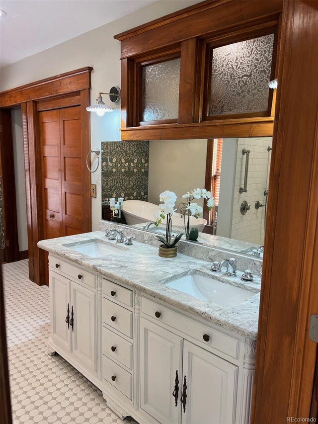 405 2nd Ave, Monte Vista, CO 81144 - bathroom featuring double vanity, a tile shower, tile patterned floors, and a freestanding bath