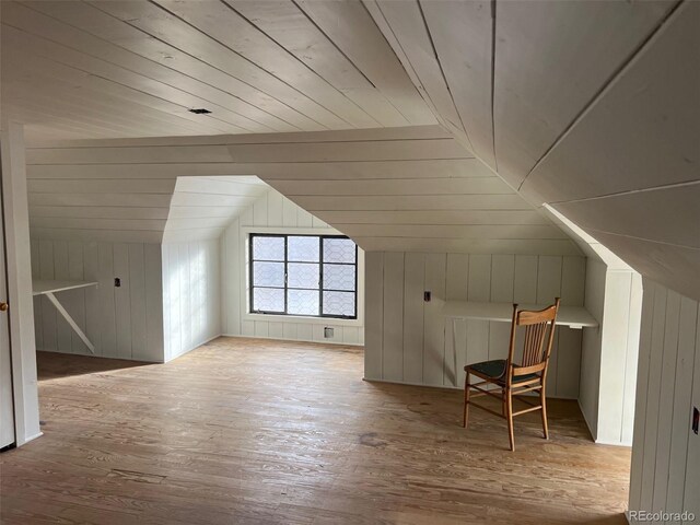 405 2nd Ave, Monte Vista, CO 81144 - additional living space with vaulted ceiling, hardwood / wood-style floors, wood walls, and wooden ceiling