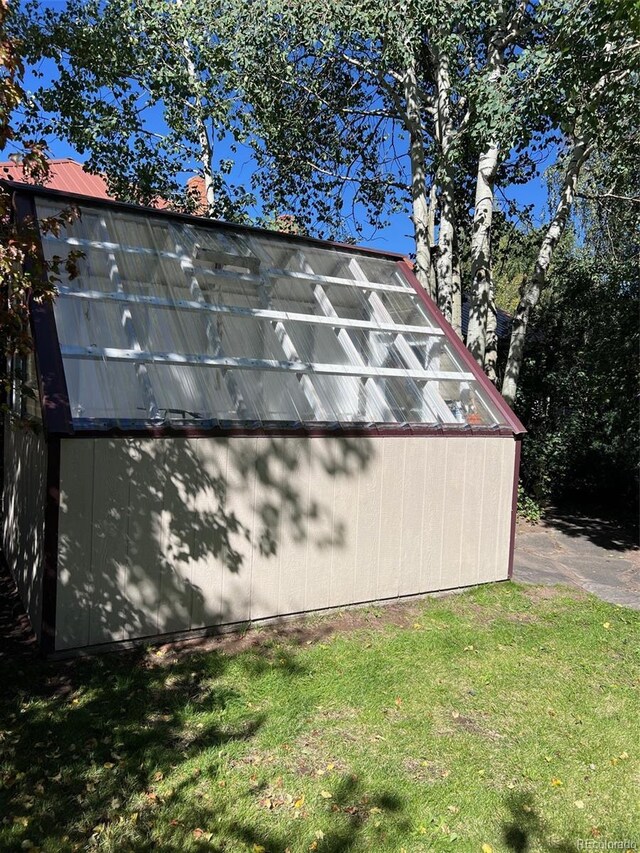 405 2nd Ave, Monte Vista, CO 81144 - view of property exterior with an outbuilding and a lawn