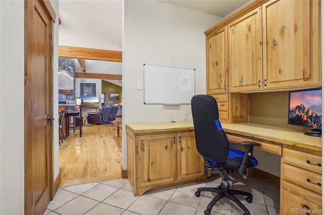 44 Canyon Ct, Eagle, CO 81631 - home office featuring built in desk, beamed ceiling, and light tile patterned floors