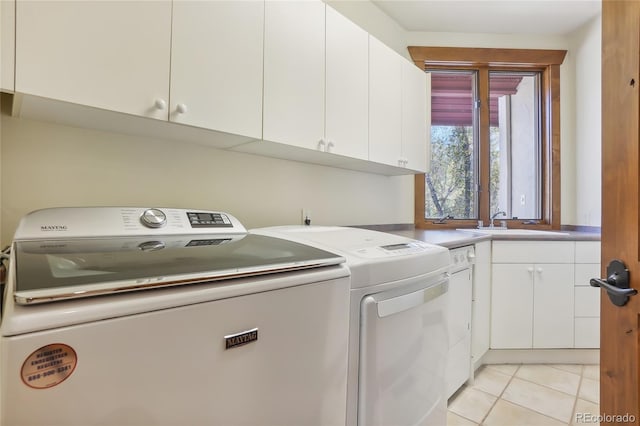 44 Canyon Ct, Eagle, CO 81631 - laundry area featuring independent washer and dryer, cabinet space, and light tile patterned floors
