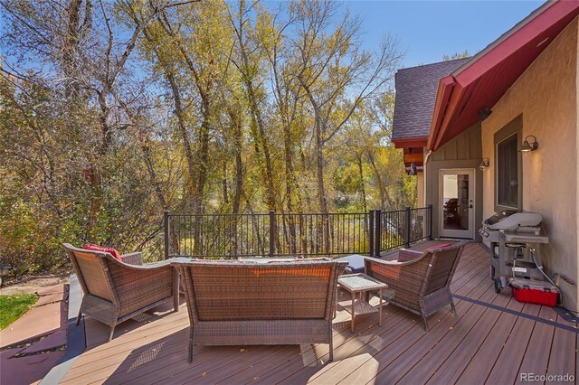 44 Canyon Ct, Eagle, CO 81631 - wooden deck with an outdoor living space and area for grilling