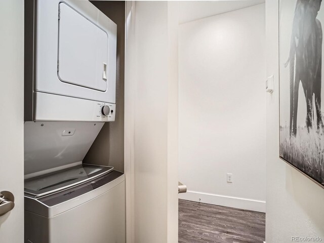 2374 S University Blvd Unit 205, Denver, CO 80210 - washroom with estacked washer and dryer and wood finished floors