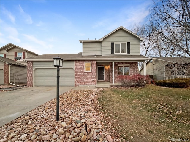 view of front property with a garage and a front lawn