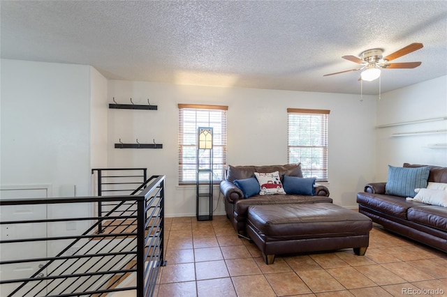 19630 E Purdue Pl, Aurora, CO 80013 - living room with a textured ceiling, light tile patterned floors, and a ceiling fan