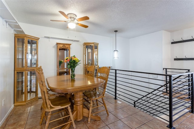 19630 E Purdue Pl, Aurora, CO 80013 - dining space featuring a textured ceiling, a ceiling fan, and tile patterned floors