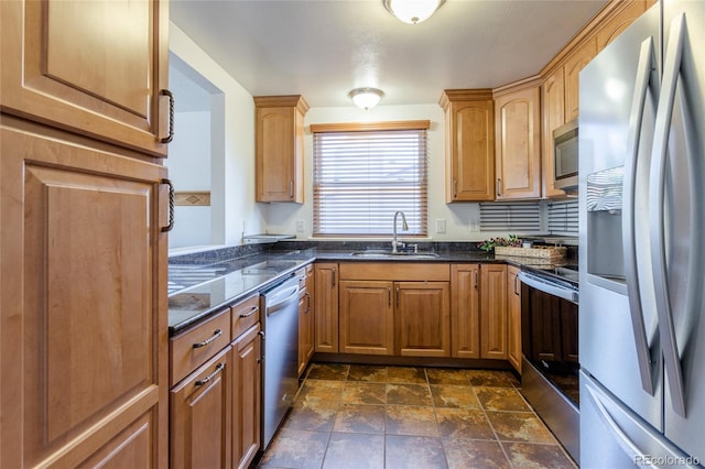 19630 E Purdue Pl, Aurora, CO 80013 - kitchen with appliances with stainless steel finishes, dark stone counters, and dark stone finish floors