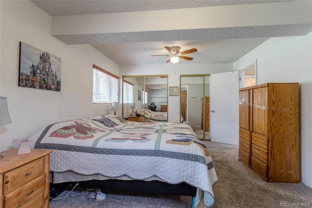 19630 E Purdue Pl, Aurora, CO 80013 - carpeted bedroom with multiple closets, a ceiling fan, and a textured ceiling