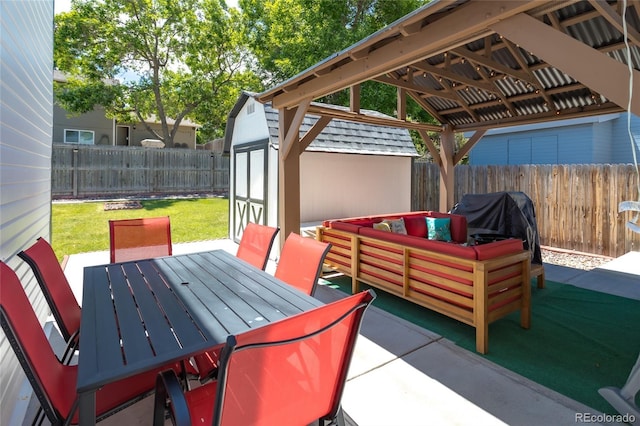 19630 E Purdue Pl, Aurora, CO 80013 - fenced backyard featuring a gazebo, a storage shed, a patio, an outdoor living space, and outdoor dining space