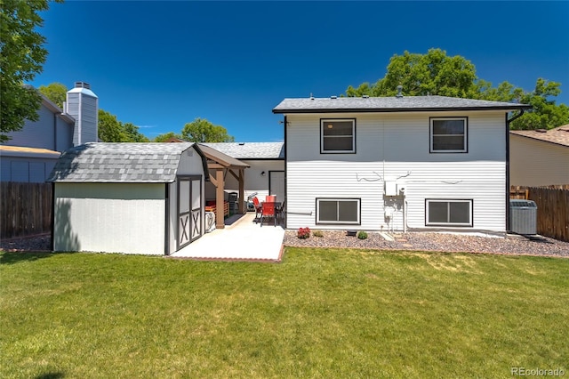 19630 E Purdue Pl, Aurora, CO 80013 - back of house with a patio, a shed, and roof with shingles