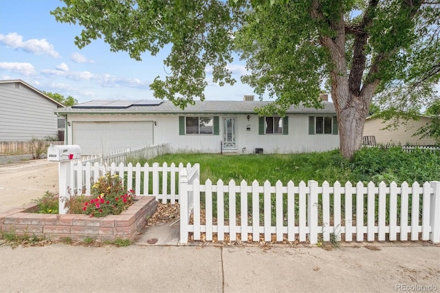 5935 Blanca Ct, Golden, CO 80403 - ranch-style home featuring an attached garage, solar panels, and concrete driveway