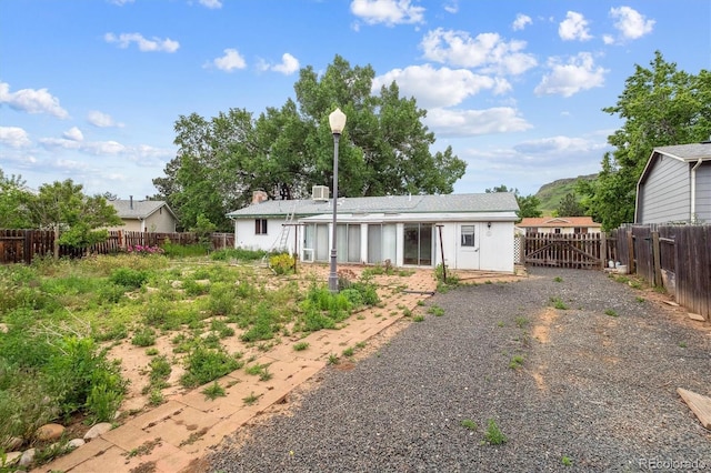 5935 Blanca Ct, Golden, CO 80403 - rear view of house with a fenced backyard