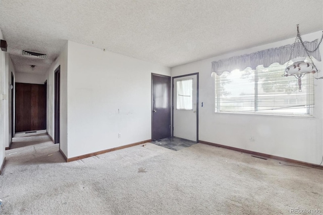 5935 Blanca Ct, Golden, CO 80403 - unfurnished living room with a textured ceiling and carpet flooring