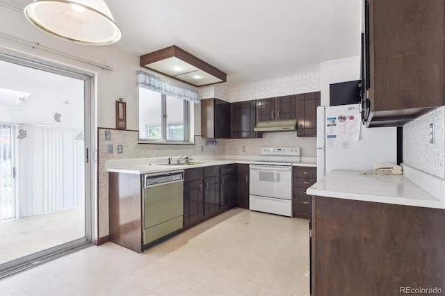 5935 Blanca Ct, Golden, CO 80403 - kitchen featuring white appliances, under cabinet range hood, light flooring, and dark brown cabinetry