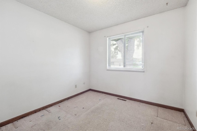 5935 Blanca Ct, Golden, CO 80403 - carpeted spare room featuring a textured ceiling and baseboards