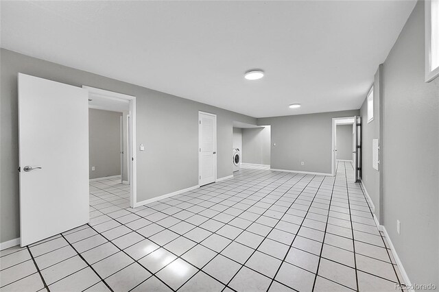 2971 S Sheridan Blvd, Denver, CO 80227 - below grade area featuring washer / dryer, baseboards, and light tile patterned floors