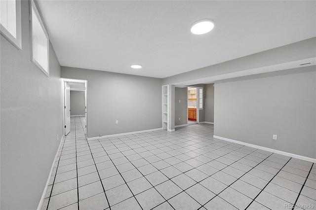2971 S Sheridan Blvd, Denver, CO 80227 - empty room featuring light tile patterned floors, baseboards, and built in features