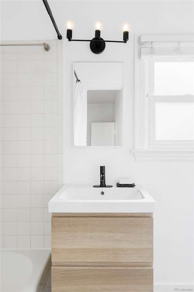 bathroom with vanity and shower / bathtub combination