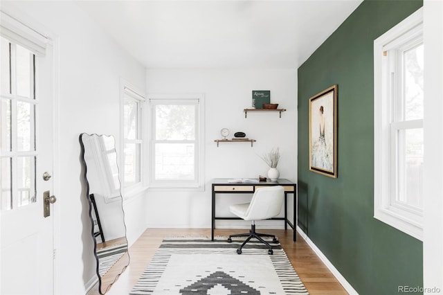 office area featuring wood finished floors and baseboards