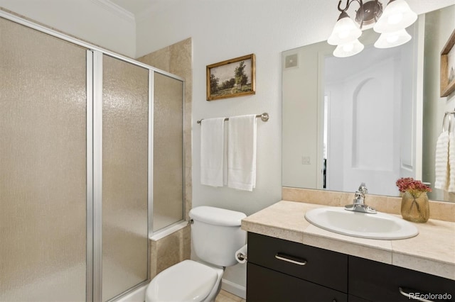 2100 N Humboldt St Unit 302, Denver, CO 80205 - bathroom with toilet, vanity, a shower stall, a chandelier, and crown molding