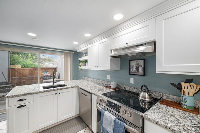 6937 S Knolls Way, Centennial, CO 80122 - kitchen with stainless steel appliances, a sink, under cabinet range hood, white cabinets, and a peninsula