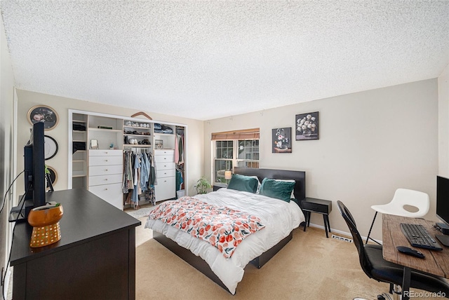 6937 S Knolls Way, Centennial, CO 80122 - bedroom with a closet, a textured ceiling, light colored carpet, and an office area