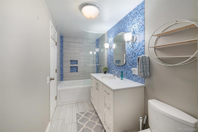 6937 S Knolls Way, Centennial, CO 80122 - full bathroom with toilet, vanity, bathing tub / shower combination, and tile walls