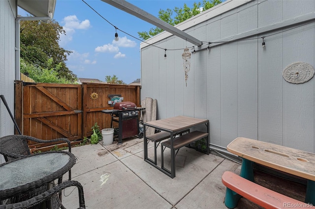 6937 S Knolls Way, Centennial, CO 80122 - view of patio with outdoor dining area, a gate, and area for grilling