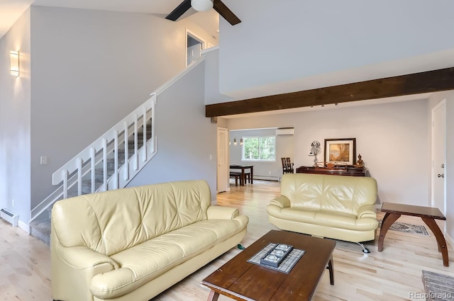 living room featuring light hardwood / wood-style flooring, ceiling fan, a wall unit AC, and a baseboard radiator