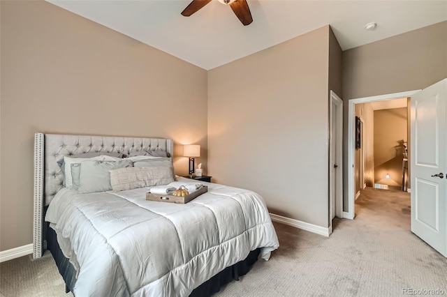 bedroom featuring baseboards, a ceiling fan, and light colored carpet