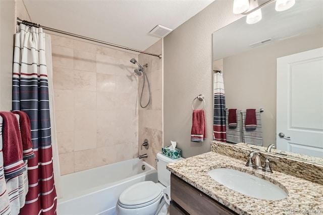 bathroom with toilet, vanity, visible vents, and shower / tub combo with curtain