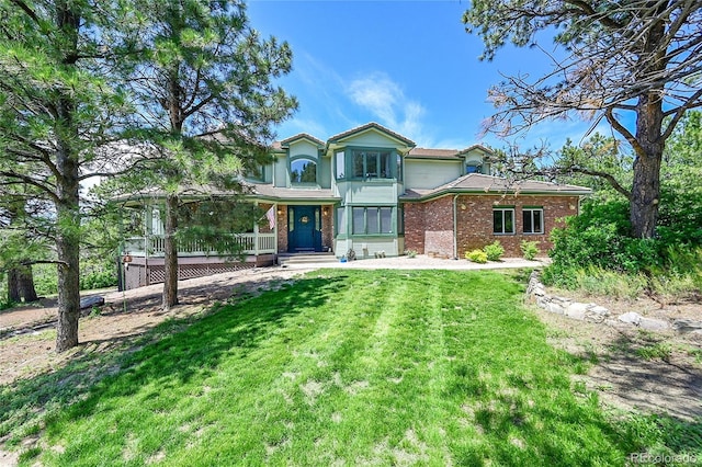 6681 Flintwood Rd, Parker, CO 80138 - view of front of house with brick siding, a front yard, and covered porch