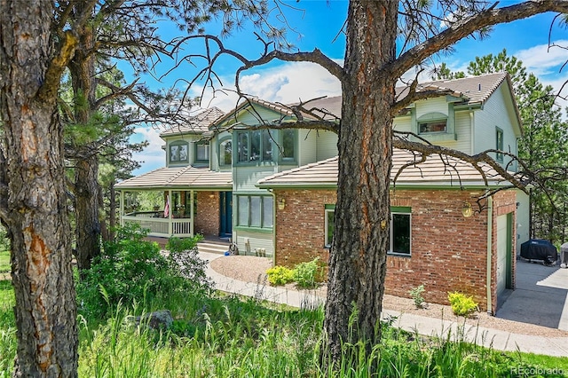 6681 Flintwood Rd, Parker, CO 80138 - view of front of home featuring brick siding and a porch
