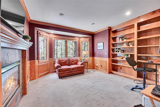 6681 Flintwood Rd, Parker, CO 80138 - office space with ornamental molding, wainscoting, plenty of natural light, a tiled fireplace, and carpet