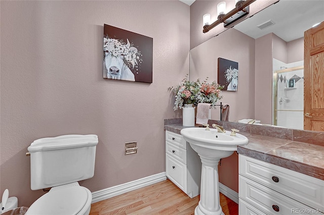 6681 Flintwood Rd, Parker, CO 80138 - full bathroom featuring wood finished floors and a stall shower