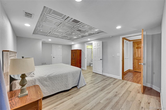 6681 Flintwood Rd, Parker, CO 80138 - bedroom with recessed lighting, light wood-type flooring, an ornate ceiling, and connected bathroom